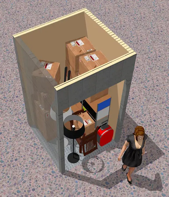 A woman standing in front of boxes and a box.